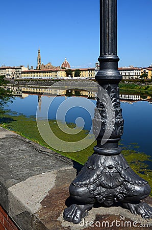 The Basilica of the Holy Cross and the Cathedral of Santa Maria del Fiore reflected in the river Arno in Florence Stock Photo