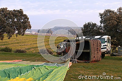 The basket of an aerostatic balloon lying on the ground Stock Photo