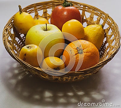Basket of assorted seasonal fruits Stock Photo