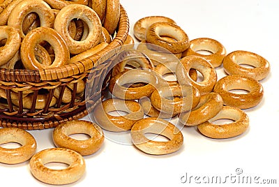 Basket with bread ring on a white background Stock Photo
