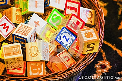 Basket of Children`s Toy Alphabet Blocks Stock Photo