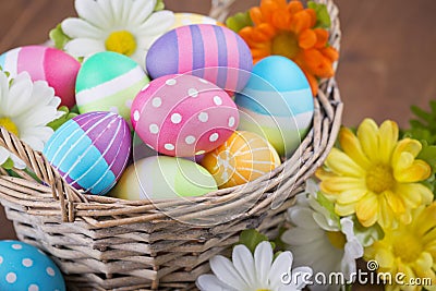 Basket with colourful hand-painted Easter eggs Stock Photo