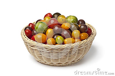 Basket with different color organic tomatoes Stock Photo