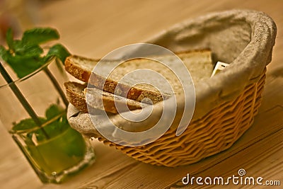 Basket of fresh bread and mint lemonade Stock Photo