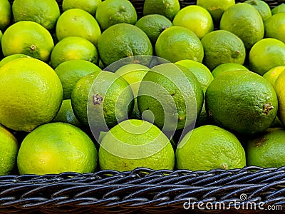 Basket of Fresh, Ripe, Juicy Organic Limes Stock Photo