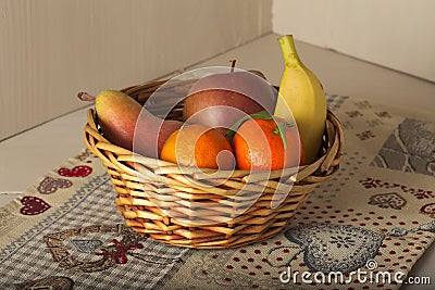 Basket of fresh seasonal fruit, mandarin, apple, pear, banana Stock Photo