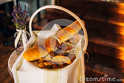 Basket with freshly baked rolls. Stock Photo