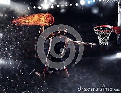 Basket player throws the fireball at the stadium Stock Photo