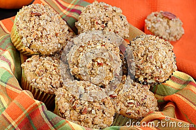 Basket of Pumpkin, Pecan and streusal muffins Stock Photo