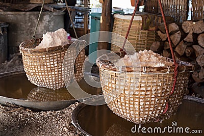 A basket of salt obtained from boiling. mountain salt has only one place in the world at Bo Kluea Thailand Stock Photo