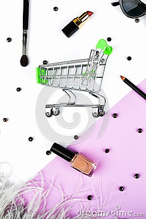 Basket and womens accessories. Womens accessories, on a pink background pastel. Beauty and fashion concept. Top view, flat Stock Photo