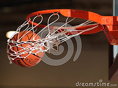 Basketball ball going through the net. Editorial Stock Photo