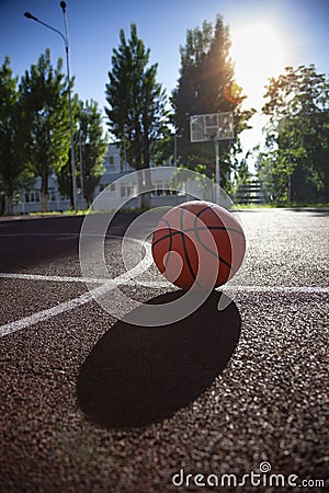 Basketball ball on the outdoors cour Stock Photo