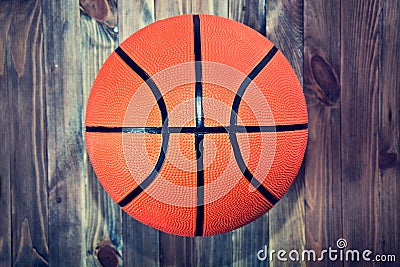 Basketball ball on wooden hardwood floor. Stock Photo