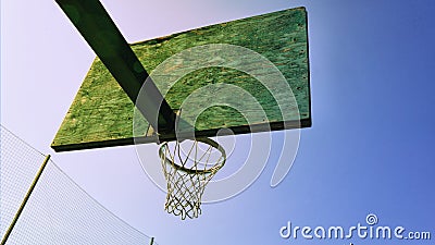 Basketball basket, in the bright rays of illumination Stock Photo