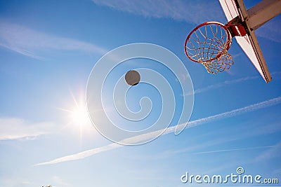 Basketball close up, basketball bal in hoop at sunny day Stock Photo