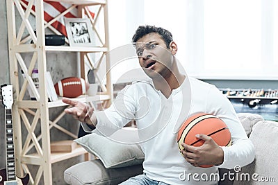 Basketball Fan with Upset Emotion Watching Game. Stock Photo