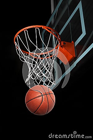 Basketball Going Through Hoop Stock Photo