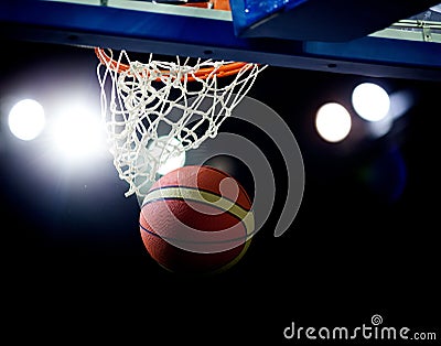 Basketball going through the hoop Stock Photo