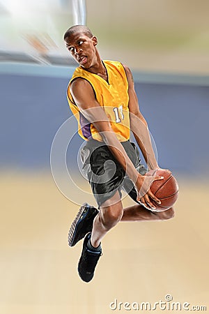 Basketball Player Dunking Ball Stock Photo