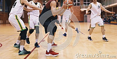 Basketball Players in Action. High School Basketball Team Playing Game Stock Photo