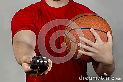 Basketball and Remote Control. Stock Photo