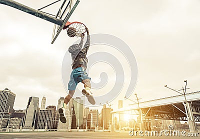 Basketball street player making a rear slam dunk. Stock Photo