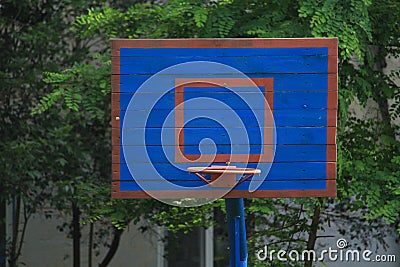 Basketball wooden backboard with a ring on an indoor yard Stock Photo