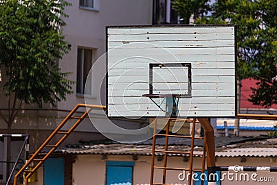 Basketball wooden backboard with a ring on an indoor yard Stock Photo