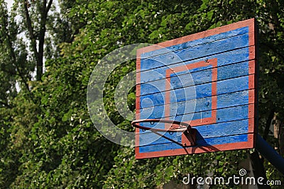 Basketball wooden backboard with a ring on an indoor yard Stock Photo