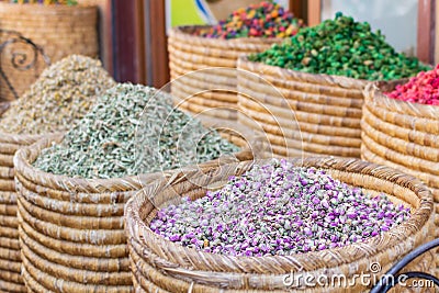 Baskets of colorful natural organic herbal tea in Marrakech market, Morocco. group of beautiful dry colorful flowers. Dried roses Stock Photo