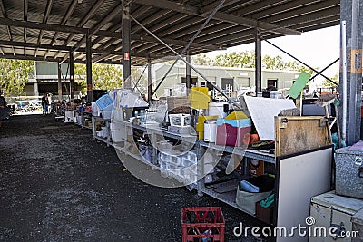 Baskets and containers at a dump recycle centre. Editorial Stock Photo