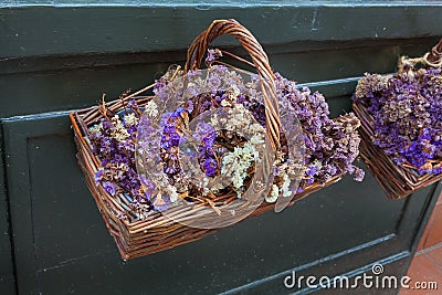Baskets of dried flowers on display Stock Photo