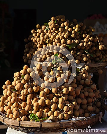 Baskets full of tropical longan fruit Stock Photo