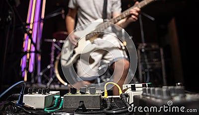 Close-up set of distortion effect pedals for guitar on stage Stock Photo