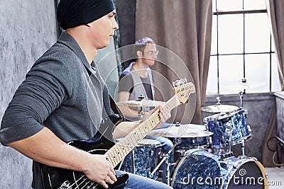 Bass guitarist and drummer play music Stock Photo