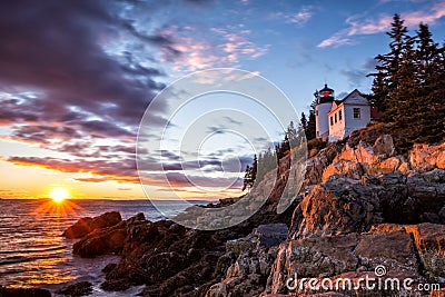 Bass Harbor Lighthouse at sunset Acadia National Park Stock Photo