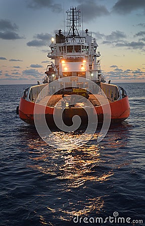 Bass Strait supply vessel to offshore platforms captured at sunset Stock Photo