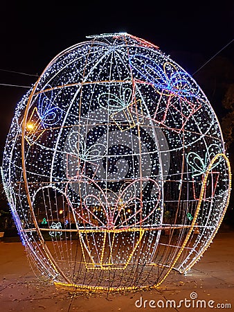 Christmas lights decorate a giant egg in Bastos/Brazil. Editorial Stock Photo