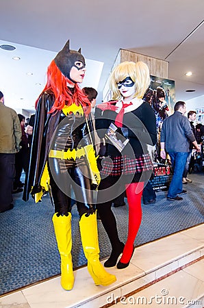 Bat Girl and Harley Quinn cosplayers Editorial Stock Photo