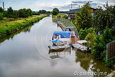 Bata water canal with boat and small pier, Uherske Hradiste Stock Photo