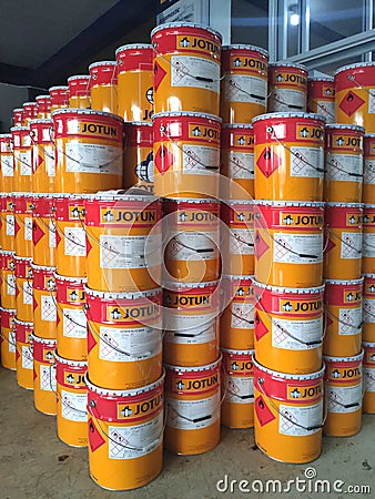 Piles of Jotun brand paint cans. Editorial Stock Photo