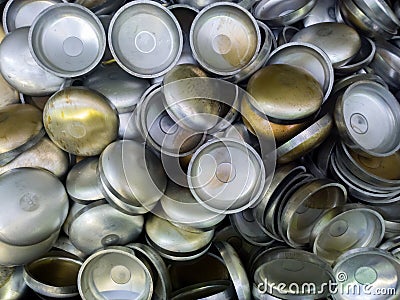A batch of thick annealed alluminium stamped half-spherical parts. Random piled-up pattern with top-down view Stock Photo