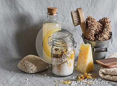 Bath accessories - homemade sea salt with calendula, natural shampoo, brush, washcloth, pumice, homemade oat soap. Health, beauty Stock Photo