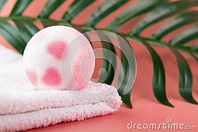 Bath bomb on a towel, shower salt ball, copy space Stock Photo