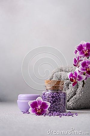 Bath products for wellness and spa with purple orchid flowers Stock Photo