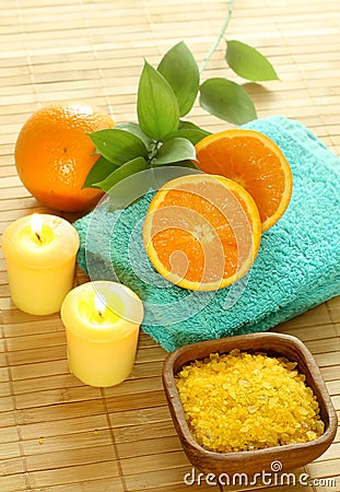 Bath salt in wooden bowl, towel, candle and fresh Stock Photo