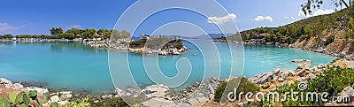 Bath in the sea with tourists and vacationers at the thermal healing hot springs of the Greek resort of Methana on the Peloponnese Stock Photo