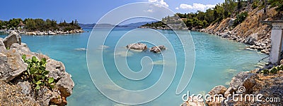 Bath in the sea with tourists and vacationers at the thermal healing hot springs of the Greek resort of Methana on the Peloponnese Stock Photo