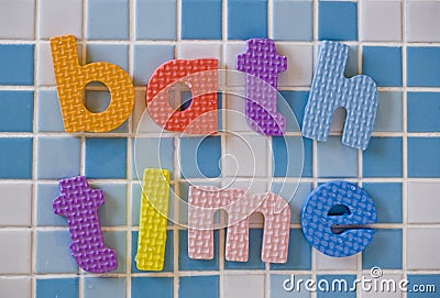 Bath time on white and blue tiles Stock Photo